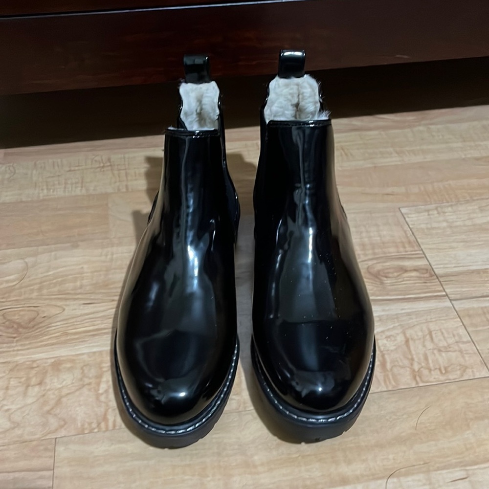 Anne Klein black rain boots with faux fur lining.